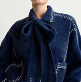 Dark blue knit with contrasting stitching and self-fabric scarf