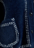 Dark blue knit with contrasting stitching and self-fabric scarf